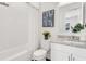 Bathroom with shower, tub, natural light, and elegant decorative elements at 5530 N 9Th St # 1, Tampa, FL 33604
