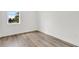 Bedroom with hardwood flooring, natural light from the window, and neutral wall color at 5530 N 9Th St # 1, Tampa, FL 33604