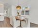 Bright dining area featuring a square wooden table, comfortable seating, and a stylish pendant light at 5530 N 9Th St # 1, Tampa, FL 33604
