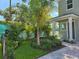 Inviting front yard featuring lush landscaping, a brick pathway, and a well-maintained garden at 5530 N 9Th St # 1, Tampa, FL 33604