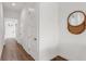 Hallway with hardwood floors, white doors, and modern decor for a clean, inviting feel at 5530 N 9Th St # 1, Tampa, FL 33604