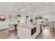 Open concept kitchen with a view of the dining room, stainless steel appliances, and marble countertops at 5530 N 9Th St # 1, Tampa, FL 33604