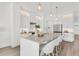 Bright kitchen featuring marble countertops, an island with counter seating, and stainless steel appliances at 5530 N 9Th St # 1, Tampa, FL 33604