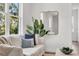Comfortable living room with a large window and stylish neutral decor at 5530 N 9Th St # 1, Tampa, FL 33604