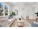 A bright, airy living room boasts hardwood floors and neutral decor at 5530 N 9Th St # 1, Tampa, FL 33604