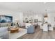 Open-concept living space connects living room, kitchen, and dining area, creating a spacious and inviting atmosphere at 5530 N 9Th St # 1, Tampa, FL 33604