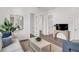 Bright living room with neutral tones, stylish decor, and multiple entryways at 5530 N 9Th St # 1, Tampa, FL 33604