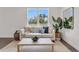 Stylish living room with large windows, comfortable seating, and modern decor at 5530 N 9Th St # 1, Tampa, FL 33604