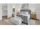 Cozy main bedroom featuring a plush bed, soft lighting, and stylish decor for a tranquil retreat at 5530 N 9Th St # 1, Tampa, FL 33604