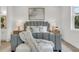 Comfortable main bedroom featuring a plush bed, soft lighting, and stylish decor for a relaxing retreat at 5530 N 9Th St # 1, Tampa, FL 33604