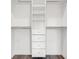 Well-organized walk-in closet with built-in shelving and drawers for ample storage space at 5530 N 9Th St # 1, Tampa, FL 33604