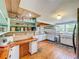 Beautiful farmhouse kitchen has an abundance of counter space and custom shelves to show off decor and accessories at 5870 Jim Davis Rd, Parrish, FL 34219