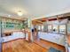 Gourmet kitchen features an open design, custom cabinetry, wood island, and views to the exterior porch at 5870 Jim Davis Rd, Parrish, FL 34219