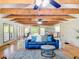 The open-concept living room features high ceilings, hardwood floors, and an open concept at 5870 Jim Davis Rd, Parrish, FL 34219