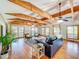 The living room features high ceilings, hardwood floors, and ample natural light from many windows at 5870 Jim Davis Rd, Parrish, FL 34219