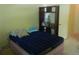 Bedroom featuring a bed and shelves at 6130 Whimbrelwood Dr, Lithia, FL 33547
