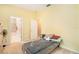 Bedroom with neutral walls, showing the closet, and an adjacent bathroom at 6130 Whimbrelwood Dr, Lithia, FL 33547