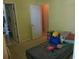 Bedroom featuring a doorway to the bathroom and closet at 6130 Whimbrelwood Dr, Lithia, FL 33547