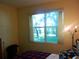 Bedroom with natural light streaming through the window at 6130 Whimbrelwood Dr, Lithia, FL 33547