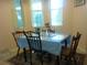 Dining room with a small table and natural light from nearby windows at 6130 Whimbrelwood Dr, Lithia, FL 33547