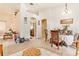Bright dining area showcasing neutral wall colors and seamless flow to adjacent kitchen at 6130 Whimbrelwood Dr, Lithia, FL 33547
