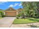 Charming single-Gathering home with manicured lawn and beautiful landscaping at 6130 Whimbrelwood Dr, Lithia, FL 33547