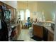 Functional kitchen with wood cabinets, black appliances, and a view into the dining area at 6130 Whimbrelwood Dr, Lithia, FL 33547