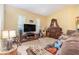 Comfortable living room boasting ample natural light and spacious seating, perfect for relaxation at 6130 Whimbrelwood Dr, Lithia, FL 33547