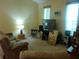 Living room featuring comfortable seating, a television, and ample decor at 6130 Whimbrelwood Dr, Lithia, FL 33547