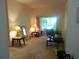 Cozy living room with a sliding glass door to the patio and comfortable furnishings at 6130 Whimbrelwood Dr, Lithia, FL 33547