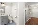 Stylish bathroom features a modern vanity, shiplap walls, decorative floor tiles, and an open door to the hallway at 6230 Gannetdale Dr, Lithia, FL 33547