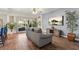 Comfortable living room with hardwood floors, sliding glass doors, and ample natural light at 6230 Gannetdale Dr, Lithia, FL 33547