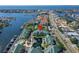 Aerial view of townhomes showcasing water access, a fountain, green roofs and coastal living at 6451 Sunset Bay Cir, Apollo Beach, FL 33572