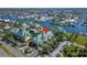 Aerial view of townhomes showcasing green roofs, water features, and parking at 6451 Sunset Bay Cir, Apollo Beach, FL 33572