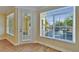 Corner view of the Balcony featuring natural light and views of the surrounding community and foliage at 6451 Sunset Bay Cir, Apollo Beach, FL 33572