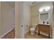 Modern half bathroom with stylish vanity, vessel sink and tile floors at 6451 Sunset Bay Cir, Apollo Beach, FL 33572