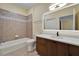 Bathroom featuring an illuminated mirror, modern vanity, and shower-tub combination at 6451 Sunset Bay Cir, Apollo Beach, FL 33572