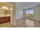 Bright bedroom with ensuite bath and wood flooring at 6451 Sunset Bay Cir, Apollo Beach, FL 33572