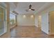 Large open bedroom area with crown molding, big windows and a ceiling fan at 6451 Sunset Bay Cir, Apollo Beach, FL 33572