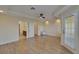 Spacious main bedroom with ceiling fan, and balcony doors with bathroom and closet entrance at 6451 Sunset Bay Cir, Apollo Beach, FL 33572