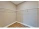 Neutral colored walk-in closet with a wooden floor and wire shelving at 6451 Sunset Bay Cir, Apollo Beach, FL 33572