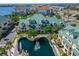 Attractive waterfront condos with a scenic water feature, complemented by lush greenery and mature palm trees at 6451 Sunset Bay Cir, Apollo Beach, FL 33572
