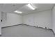 Interior of a freshly painted two-car garage with side door at 6451 Sunset Bay Cir, Apollo Beach, FL 33572