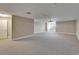 Spacious living room featuring neutral carpet, recessed lighting, and natural light at 6451 Sunset Bay Cir, Apollo Beach, FL 33572