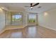 Inviting living room featuring hardwood floors, ample natural light, and an open layout at 6451 Sunset Bay Cir, Apollo Beach, FL 33572