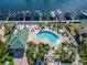Community kidney-shaped pool surrounded by landscaping and boat slips in the adjacent waterway at 6451 Sunset Bay Cir, Apollo Beach, FL 33572