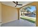 Relaxing covered porch overlooking landscaped yard with water views at 6451 Sunset Bay Cir, Apollo Beach, FL 33572
