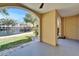 A private covered porch offers serene views of the community pond at 6451 Sunset Bay Cir, Apollo Beach, FL 33572