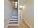 Bright stairway with wood-look floors and white risers leads to the upper level at 6451 Sunset Bay Cir, Apollo Beach, FL 33572
