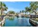 Beautiful water view of the community with lush landscaping, a fountain, and inviting architecture at 6451 Sunset Bay Cir, Apollo Beach, FL 33572